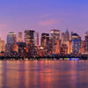 New York City Manhattan downtown skyline at dusk with skyscrapers illuminated over Hudson River panorama - Backdropsource