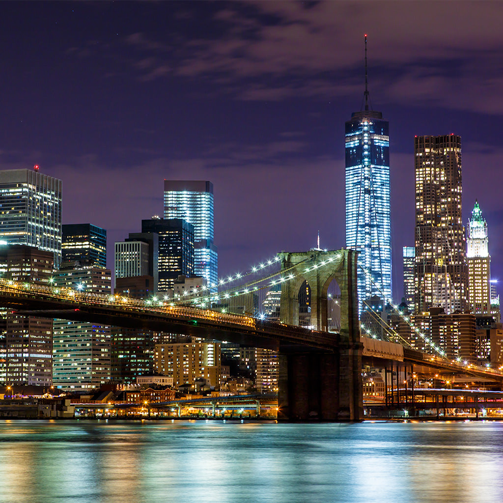 Brooklyn Bridge with Manhattan skyline in the background at night - Backdropsource