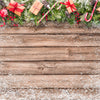 Christmas Background with Leaf Decorations and Gift Boxes on Wooden Board