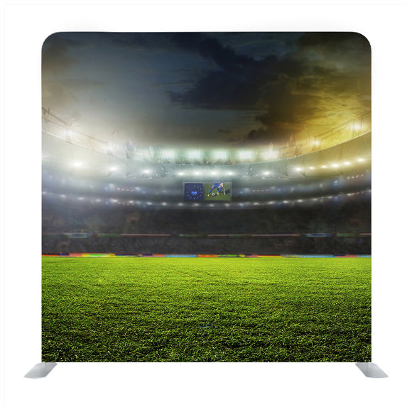 Green soccer field bright spotlights Media wall - Backdropsource