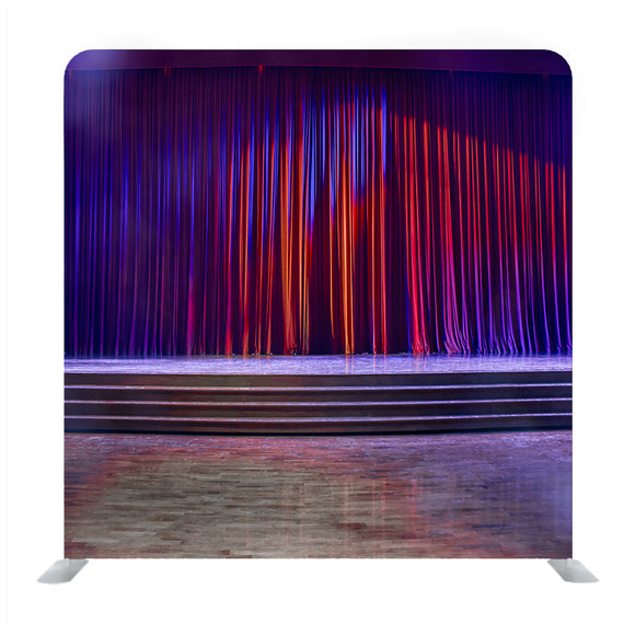 Red Curtains And The Stage Parquet With Stairs In Theater With Colorful Lighting Background Media Wall - Backdropsource
