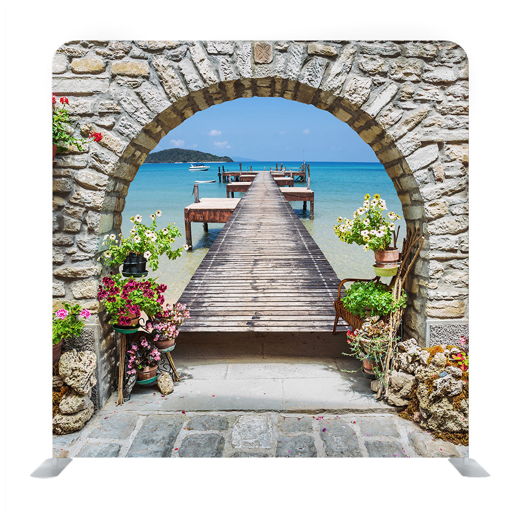Seaview Through The Stone Arch With Flowers In Italy Background Media Wall - Backdropsource