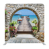 Seaview Through The Stone Arch With Flowers In Italy Background Media Wall - Backdropsource