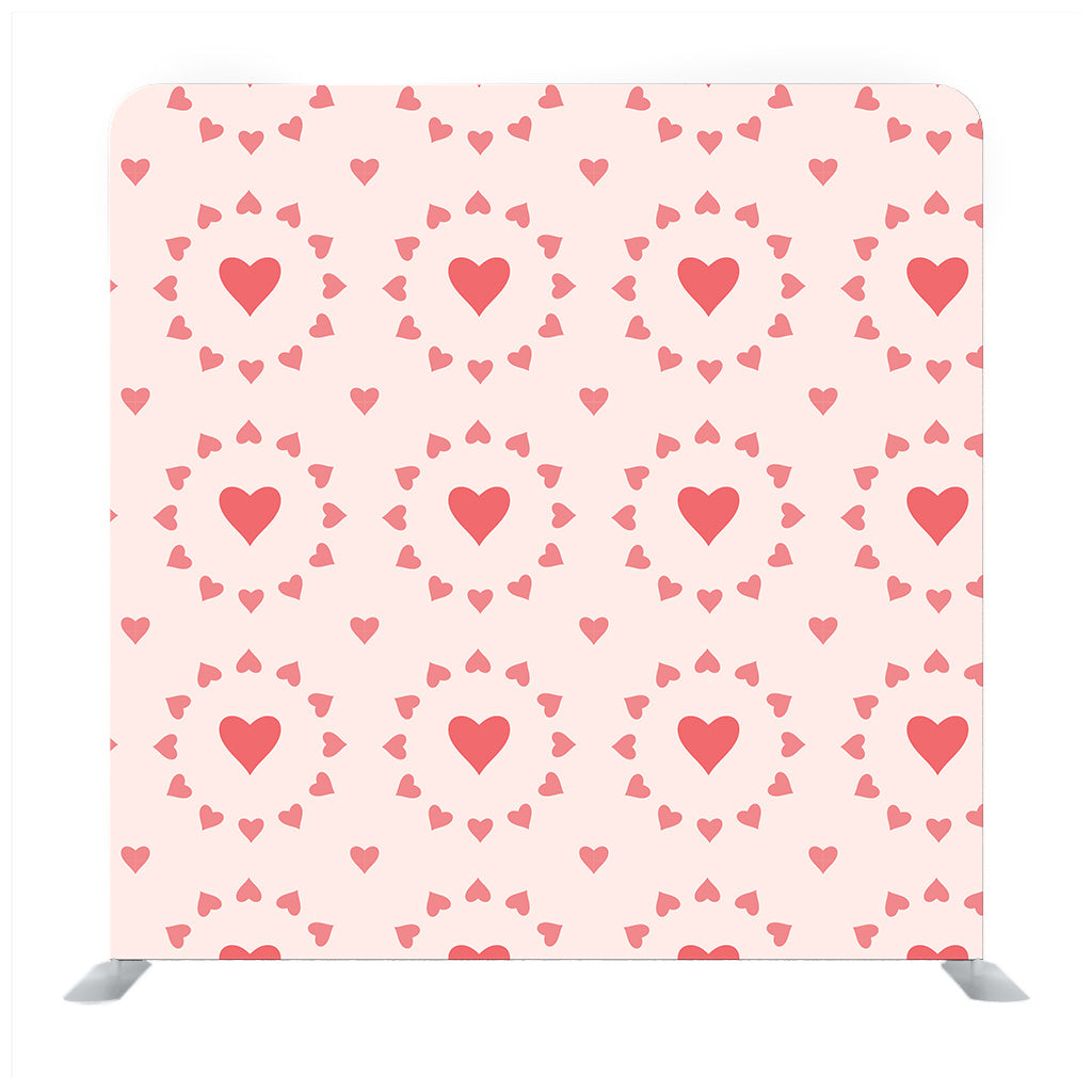 Tiny red hearts pattern with orange background Media wall - Backdropsource